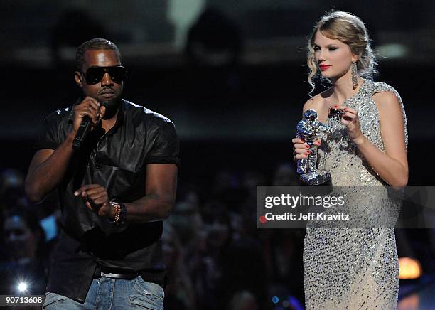 Kanye West jumps onstage as Taylor Swift accepts her award for the "Best Female Video" award during the 2009 MTV Video Music Awards at Radio City...