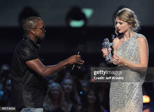 Kanye West jumps onstage as Taylor Swift accepts her award for the "Best Female Video" award during the 2009 MTV Video Music Awards at Radio City...