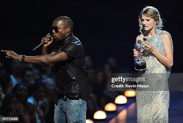 Kanye West takes the microphone from Taylor Swift and speaks onstage during the 2009 MTV Video Music Awards at Radio City Music Hall on September 13,...