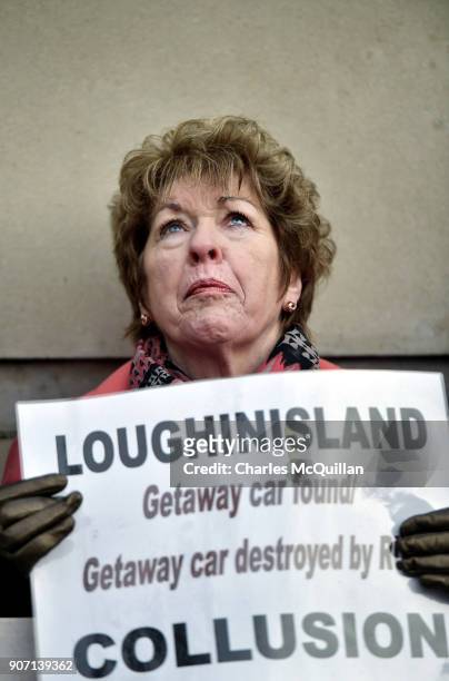 Moria Casement, the niece of Barney Greene who was murdered by loyalist gunmen in the Heights Bar, Loughinisland looks skywards as she protests...