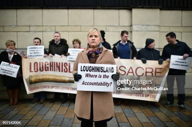 Emma Rogan, the daughter of Adrian Logan who was murdered by loyalist gunmen in the Heights Bar, Loughinisland protests outside Belfast High Court on...