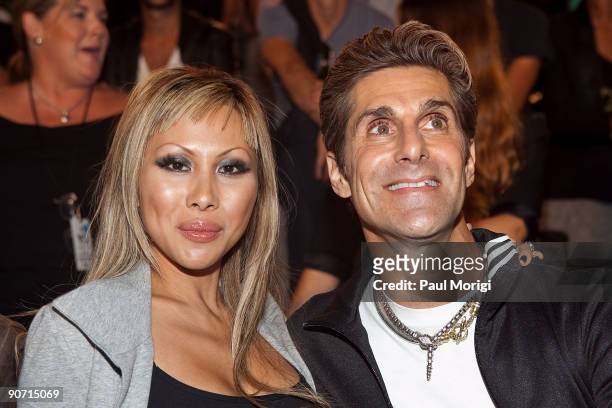Musician Perry Farrell and wife Etty Lau along the front row at Y-3 Spring 2010 during Mercedes-Benz Fashion Week at Park Avenue Armory on September...