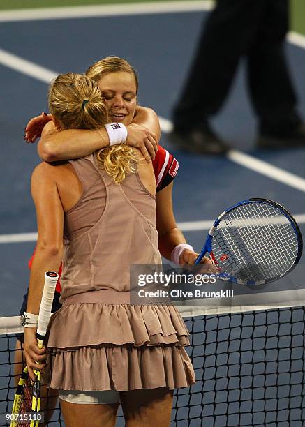 Kim Clijsters of Belgium hugs Caroline Wozniacki of Denmark at the net after the Women�s Singles final on day fourteen of the 2009 U.S. Open at the...