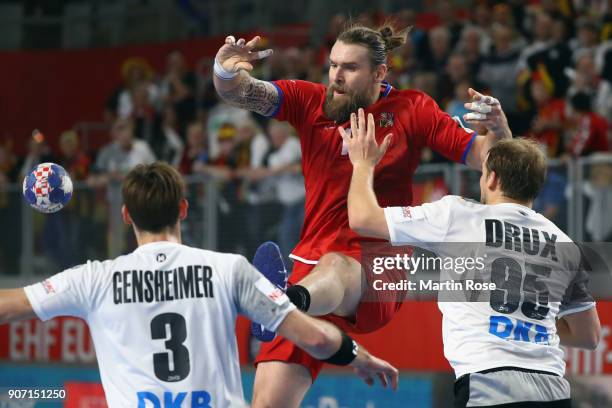 Pavel Horak of Czech Republic is challenged by Paul Drux and Uwe Gensheimer of Germany during the Men's Handball European Championship main round...