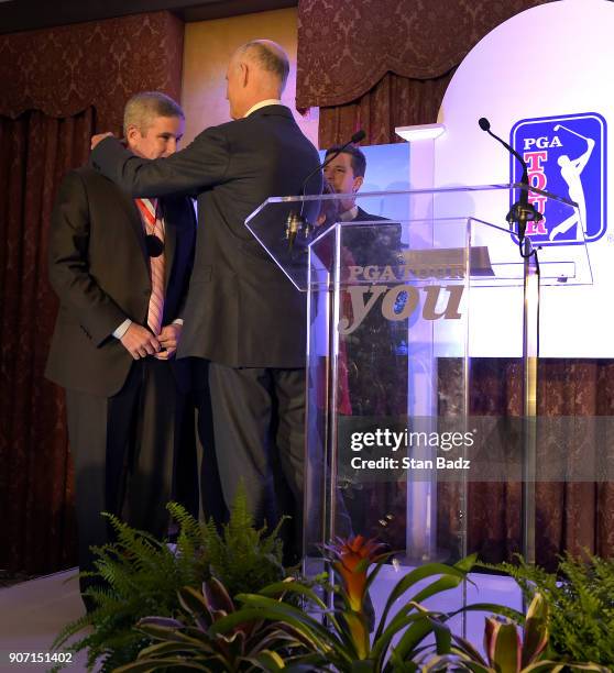 Florida Govenor Rick Scott presents PGA TOUR Commissioner Jay Monahan with the Business Ambassador Award during the PGA TOUR Global Home press...