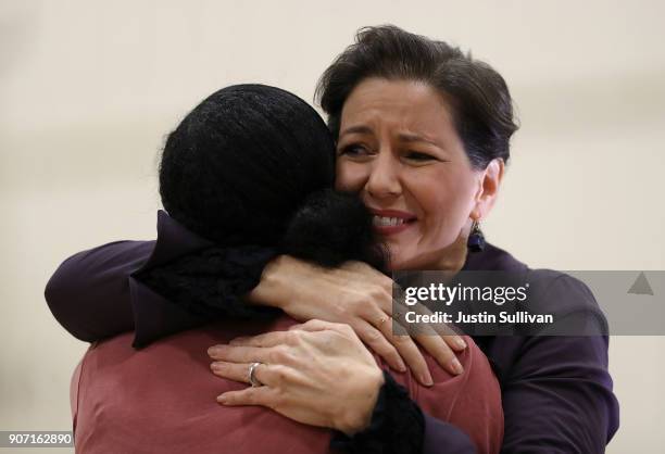 Oakland mayor Libby Schaaf hugs a student during an assembly at Edna Brewer Middle School about the U.S. Constitution on January 19, 2018 in Oakland,...