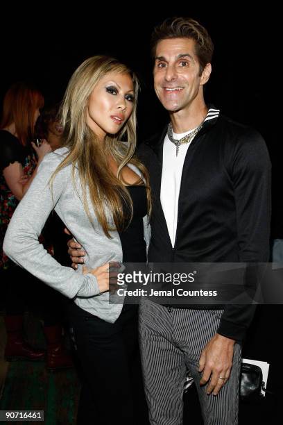 Musician Perry Farrell and wife Etty Lau Farrell pose backstage before the Y-3 Spring 2010 Fashion Show at the Park Avenue Armory on September 13,...