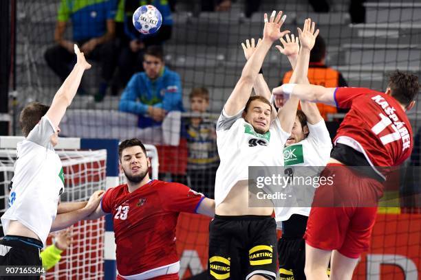 Czech Republic's Stanislav Kasparek tries to score over Germany's Paul Drux and Uwe Gensheimer during the group II match of the Men's 2018 EHF...