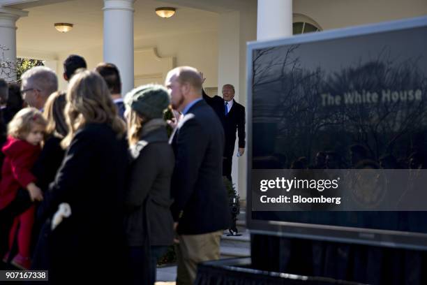 President Donald Trump, center, waves before walking into the Oval Office after addressing March for Life participants and pro-life leaders in the...