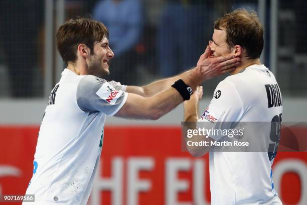 Uwe Gensheimer and Paul Drux of Germany celebrate after the Men's Handball European Championship main round group 2 match between Germany and Czech...