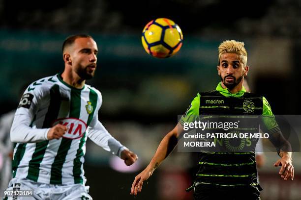 Sporting's midfielder Ruben Ribeiro vies with Vitoria Setubal's defender Pedro Pinto during the Portuguese league football match between Vitoria FC...