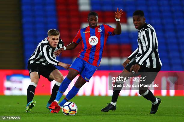 Joseph Hungbo of Crystal Palace avoids a challenge from Deese Kasinga Madia and Matty Longstaff of Newcastle during the FA Youth Cup Fourth Round...