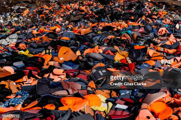 Over 500,000 refugees landed on Lesbos, Greece in 2015, their discarded life jackets have been gathered in an open landfill.
