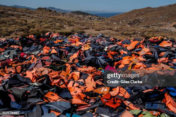 Over 500,000 refugees landed on Lesbos, Greece in 2015, their discarded life jackets have been gathered in an open landfill.