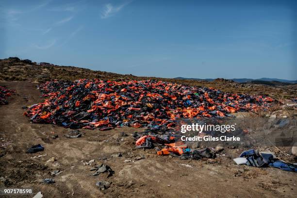 Over 500,000 refugees landed on Lesbos, Greece in 2015, their discarded life jackets have been gathered in an open landfill.