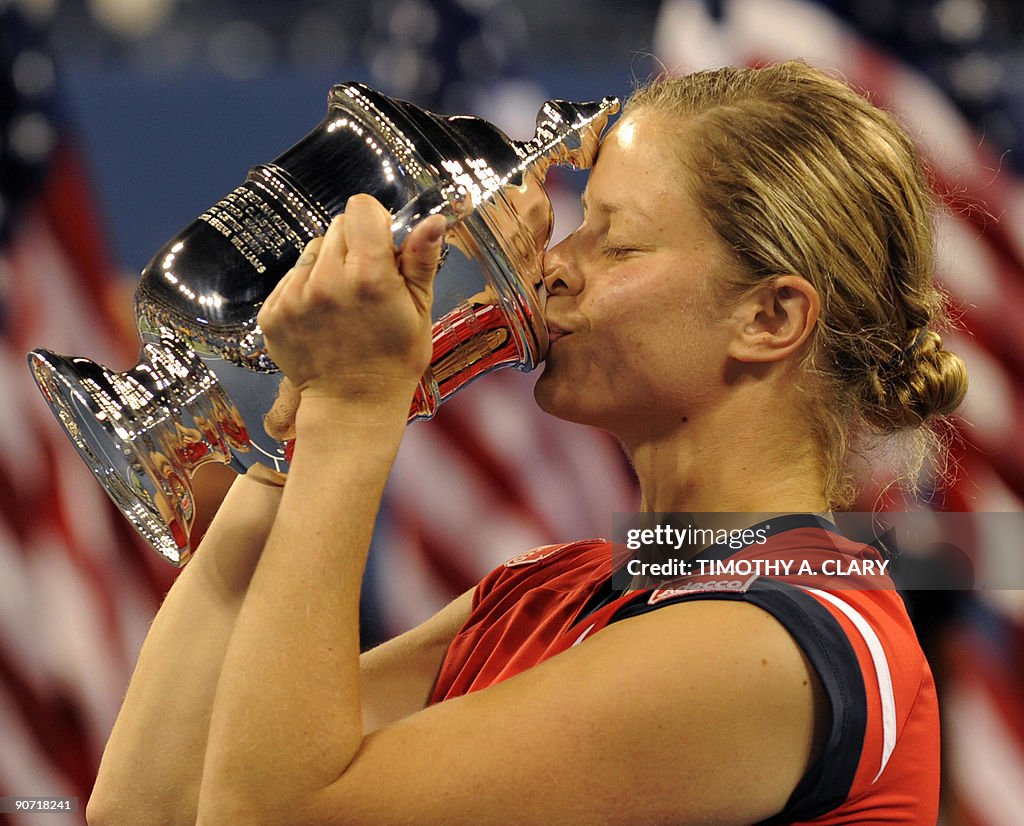 Kim Clijsters from Belgium kisses her tr
