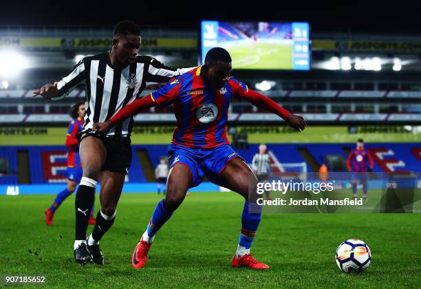 Tryick Mitchell of Crystal Palace tackles with Deese Kasinga Madia of Newcastle during the FA Youth Cup Fourth Round match between Crystal Palace and...