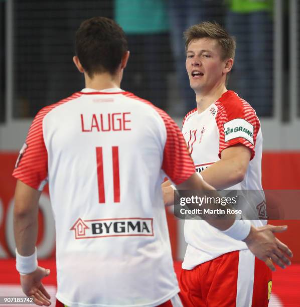 Lasse Svan of Denmark celebrates a goal with team mate Rasmus Lauge Schmidt during the Men's Handball European Championship main round group 2 match...