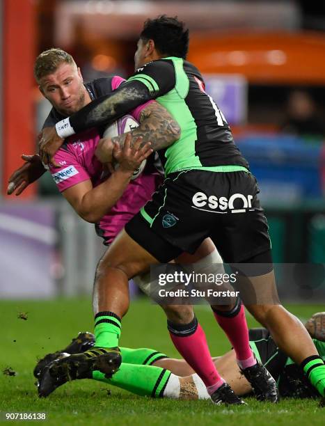 Ross Moriarty of Gloucester runs into the tackle of Frank Halai of Paloise during the European Rugby Challenge Cup match between Gloucester and...