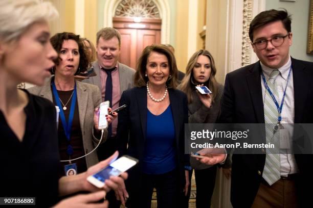 House Minority Leader Nancy Pelosi speaks with reporters as she makes her way to Senate Minority Leader Chuck Schumer's office at the U.S. Capitol...