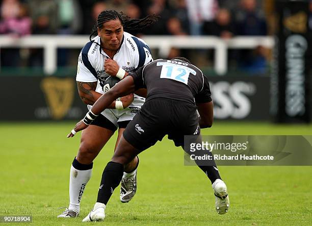 Andy Tuilagi of Sale is tackled by Gcobani Bobo of Newcastle during the Guinness Premiership match between Newcastle Falcons and Sale Sharks at...