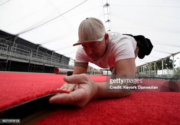 Worker install the red carpet in preparation for the 24th Annual Screen Actors Guild Awards at The Shrine Expo Hall on January 19, 2018 in Los...