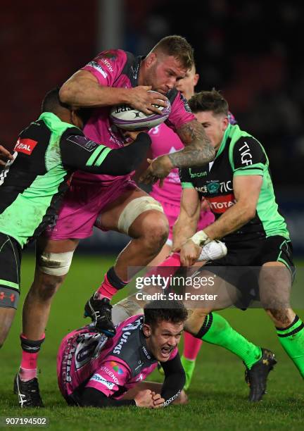 Ross Moriarty of Gloucester runs through the Paloise defence as Billy Burns reacts during the European Rugby Challenge Cup match between Gloucester...