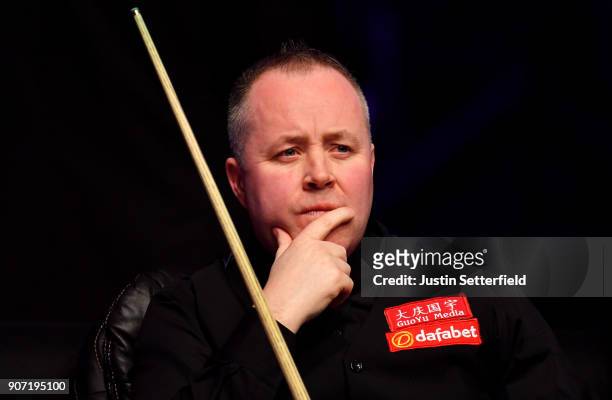 John Higgins of Scotland reacts during his match against Ryan Day of Wales during The Dafabet Masters on Day Six at Alexandra Palace on January 19,...