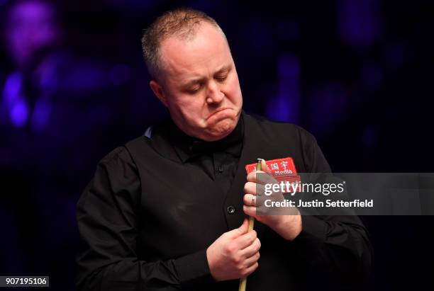 John Higgins of Scotland reacts during his match against Ryan Day of Wales during The Dafabet Masters on Day Six at Alexandra Palace on January 19,...