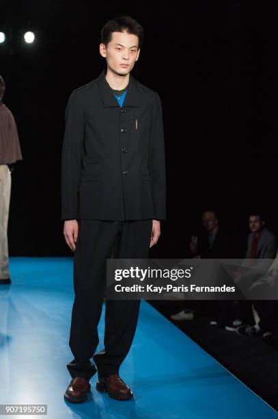 Model walks the runway during the Mackintosh 0003 Menswear Fall/Winter 2018-2019 show as part of Paris Fashion Week on January 19, 2018 in Paris,...