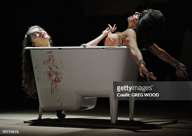 Barbara Spitz who plays 'Amor' and Melita Jurisic who plays 'Poppea' rehearse in a bath for the Barrie Kosky directed production of 'Poppea' at the...