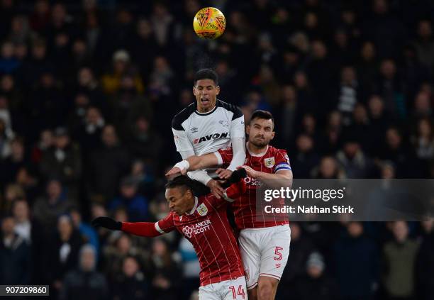 Curtis Davies of Derby County and Bobby Reid and Bailey Wright of Bristol City compete for the ball during the Sky Bet Championship match between...