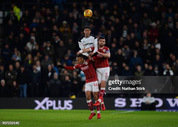 Curtis Davies of Derby County and Bobby Reid and Bailey Wright of Bristol City compete for the ball during the Sky Bet Championship match between...