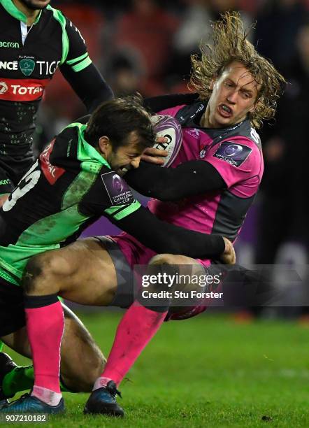 Billy Twelvetrees of Gloucester is hit hard by Conrad Smith of Paloise during the European Rugby Challenge Cup match between Gloucester and Section...