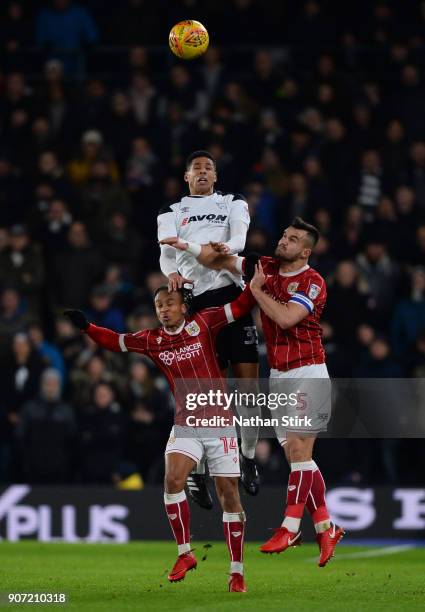 Curtis Davies of Derby County and Bobby Reid and Bailey Wright of Bristol City compete for the ball during the Sky Bet Championship match between...