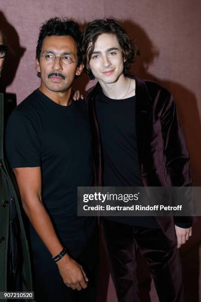 Stylist of Berluti men, Haider Ackermann and actor Timothee Chalamet pose after the Berluti Menswear Fall/Winter 2018-2019 show as part of Paris...