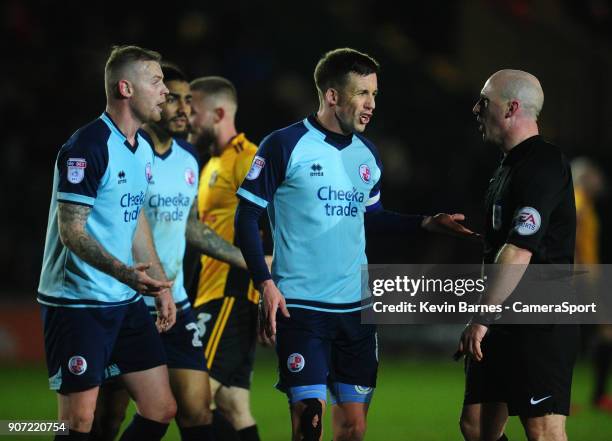 Crawley Town's Jimmy Smith protests with Referee Simon Hooper after a penalty is given against his side during the Sky Bet League Two match between...