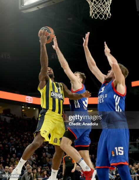 Brad Wanamaker of Fenerbahce Dogus in action against Errick McCollum and Vladimir Stimac of Anadolu Efes during a Turkish Airlines Euroleague week 19...