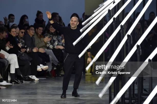 Designer Aldo Maria Camillo acknowledges the audience during the Cerruti 1881 Menswear Fall/Winter 2018-2019 show as part of Paris Fashion Week on...