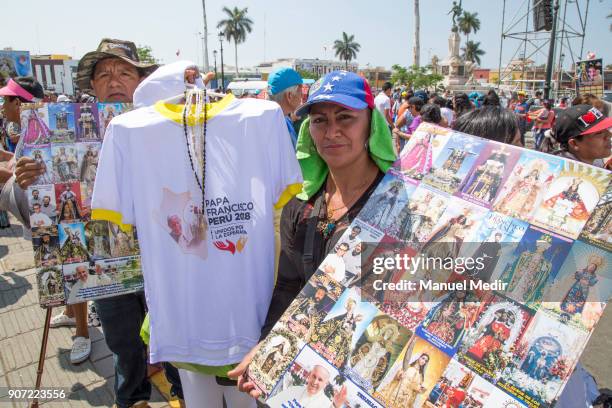 Vendor offers t-shirts with the image of Pope Francis outside Trujillo cathedral during Pope Francis 4-day apostolic visit to Peru on January 19,...