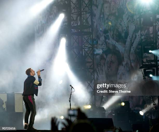 Chris Martin of Coldplay performs on stage at Old Trafford on September 12, 2009 in Manchester, England.