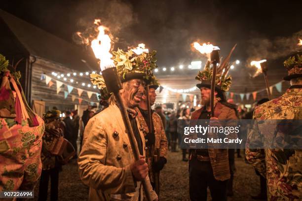 Members of the Leominster Morris prepare to lead the crowd from the Hobson Brewery in Frith Common to the nearby apple orchard to take part in a...