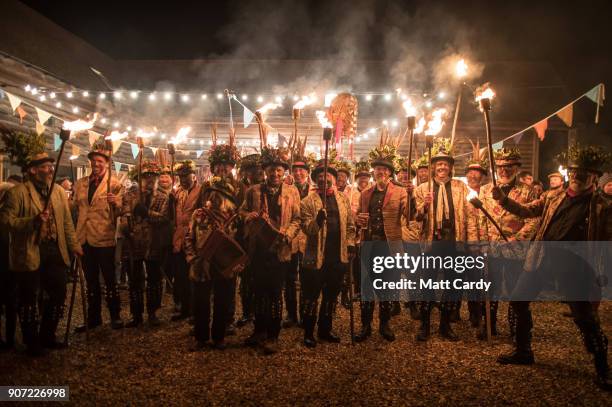 Members of the Leominster Morris prepare to lead the crowd from the Hobson Brewery in Frith Common to the nearby apple orchard to take part in a...