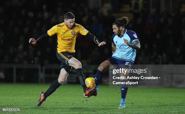 Newport County's Ben Tozer battles with Crawley Town's Josh Lelan during the Sky Bet League Two match between Newport County and Crawley Town at...