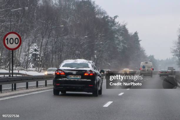 Blacj Ford Mondeo covered by the snow at the Tricity ringroad is seen in Gdansk, Poland on 19 January 2018 Heavy snow fall and wind Power has been...