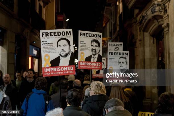 Close to Las Ramblas of Barcelona, Catalonia, Spain, people march showing posters of imprisoned politicians and pro- independentist leaders on 19...