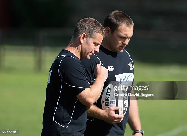 Tony Hanks the Wasps head coach talks with his assistant Trevor Woodman during the Guinness Premiership match between Bath and London Wasps at the...