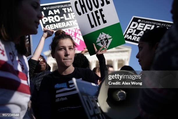 Pro-choice activist pauses as she debates with pro-life activists in front of the U.S. Supreme Court during the 2018 March for Life January 19, 2018...