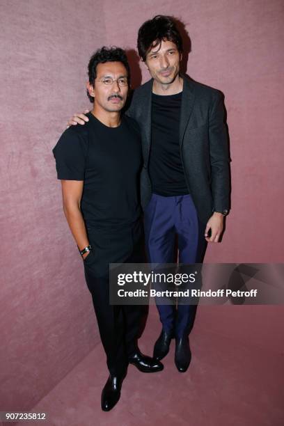 Stylist of Berluti men, Haider Ackermann and model Andres Velencoso pose after the Berluti Menswear Fall/Winter 2018-2019 show as part of Paris...