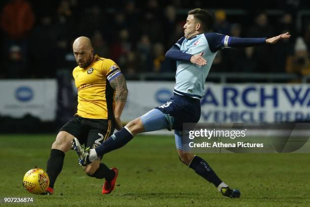David Pipe of Newport County is challenged by Jimmy Smith of Crawley Town during the Sky Bet League Two match between Newport County and Crawley Town...